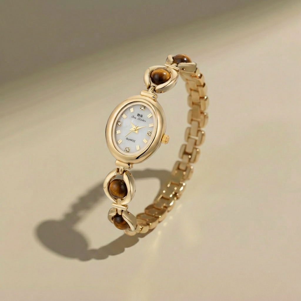 Gold watch with gemstone accents on a beige background